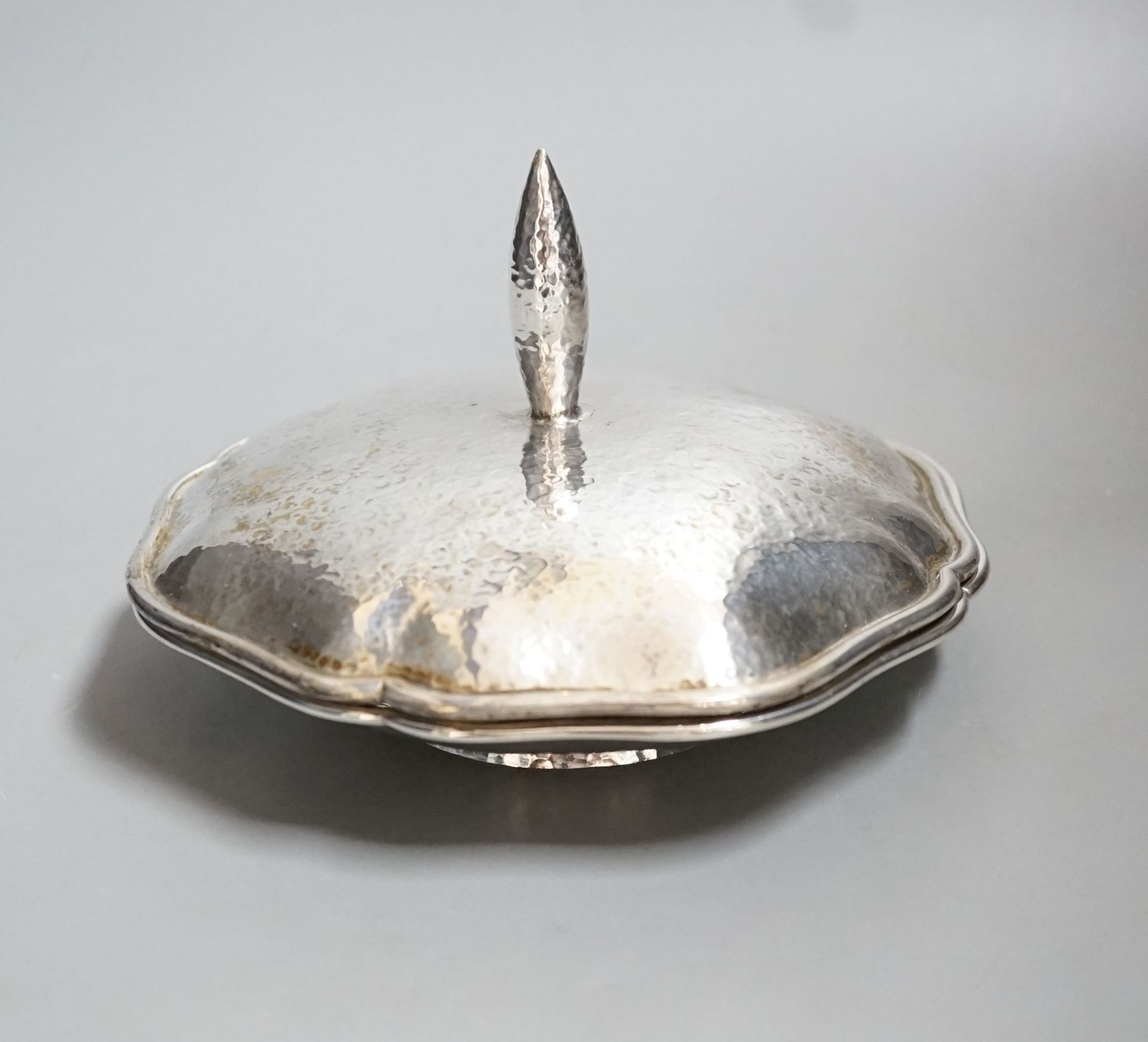 An Austro-Hungarian planished white metal dish and cover, 17.2cm, 16oz.